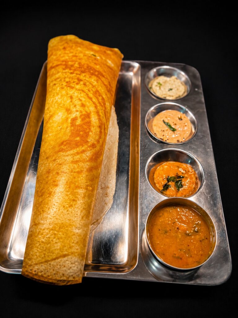Crispy South Indian dosa with sambar and chutneys served at Tanvis in Wakefield.